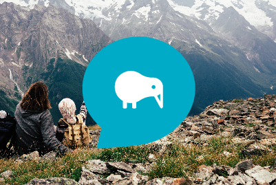 Two people on top of hill looking at snowcapped mountains with blue KiwiSaver icon overlaid